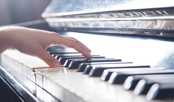 istock Caucasian girl playing piano. Music 1201381452