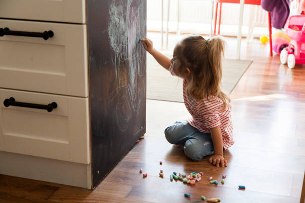 istock little girl drawing with chalks 1201381691