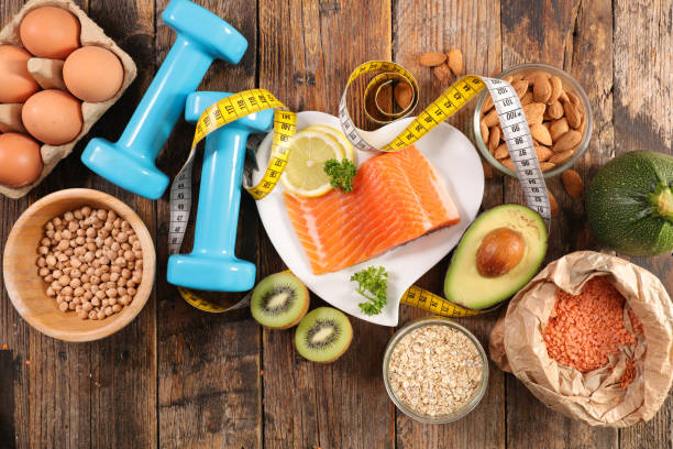istock healthy food concept with meter and dumbbell 1201383251