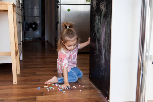 istock little girl drawing with chalks 1201385741