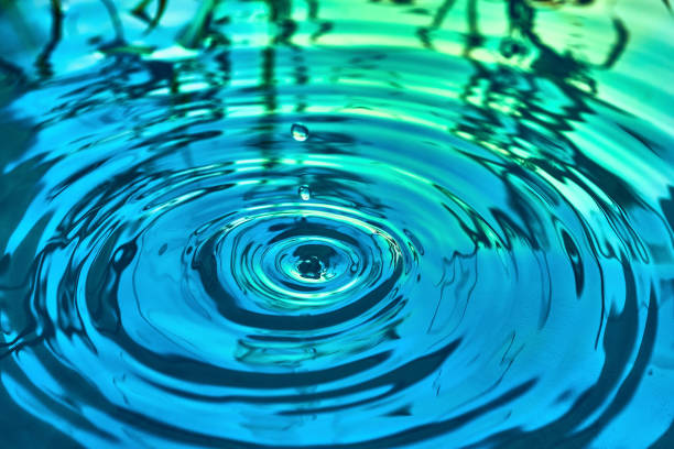 istock Raindrops fall on the surface of the water 1201386568