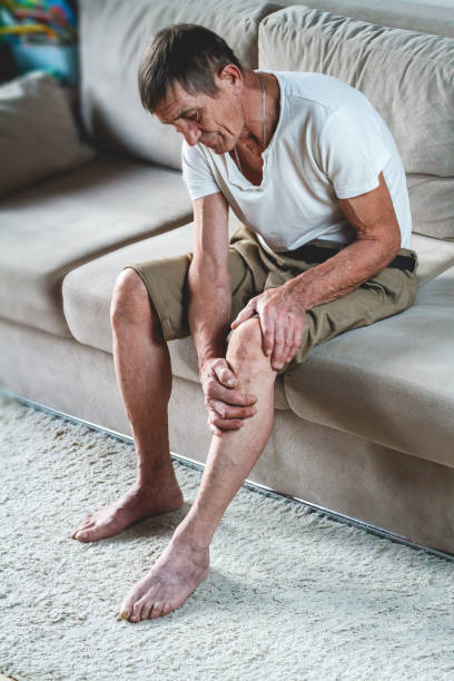 istock Knee pain in an elderly man 1201386855
