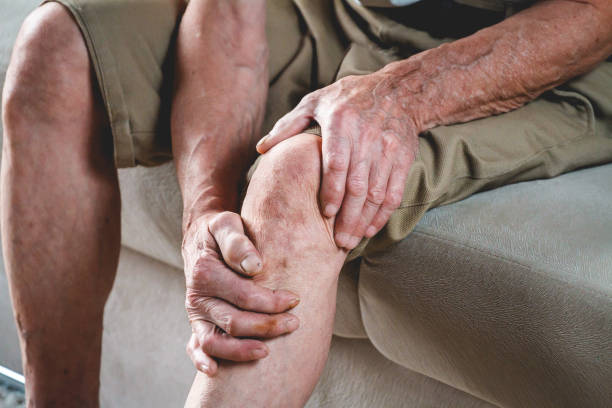 istock Knee pain in an elderly man 1201386898