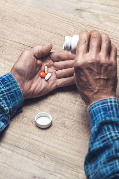 istock The pills in a Senior's hands 1201387009