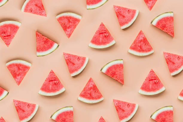istock Creative flat lay top view of fresh watermelon slices on orange table background with copy space. Minimal summer fruits pattern for blog or recipe book. Healthy food and diet concept 1201387030