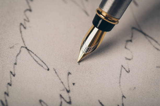 istock Fountain pen on an ancient handwritten letter. Old story. Retro style. 1201387206