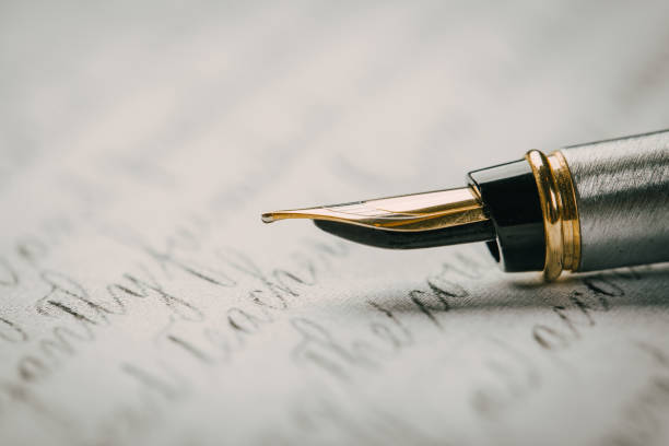 istock Fountain pen on an ancient handwritten letter. Old story. Retro style. 1201387237