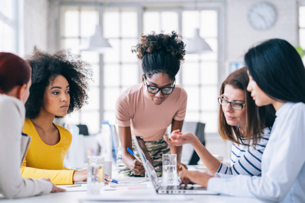istock Multi-Ethnic women business team having discussion new projects 1201387391