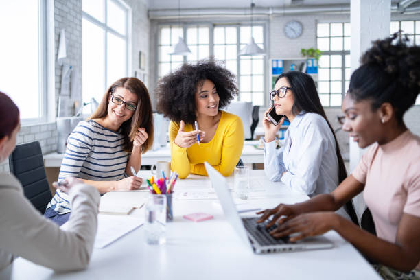 istock Multi-Ethnic women business team having discussion new projects 1201387397
