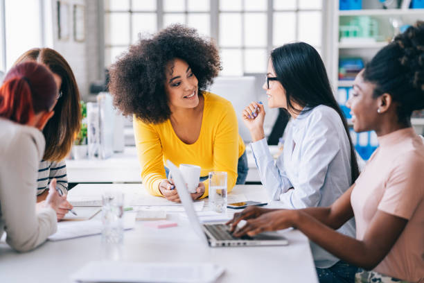 istock Multi-Ethnic women business team having discussion new projects 1201387398