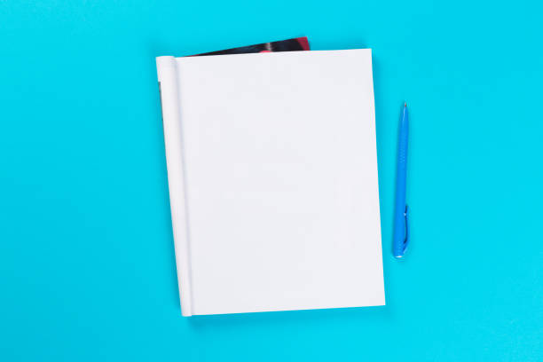 istock Sketchbook on colorful background. Copy space. top view of blank open notebook, concept of education or new workplace 1201387918