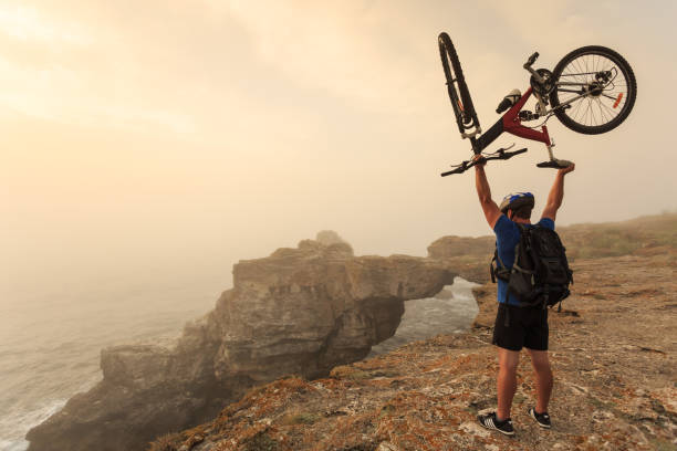istock Mountain biker picking up his bike 1201388084