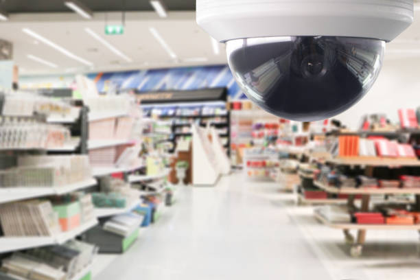 CCTV surveillance security camera transmit a video and audio signal to a wireless receiver through a radio band.Security camera for prevent product stolen in mall and supermarket stock photo