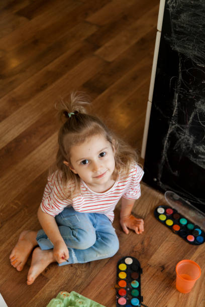istock little girl painting 1201392041