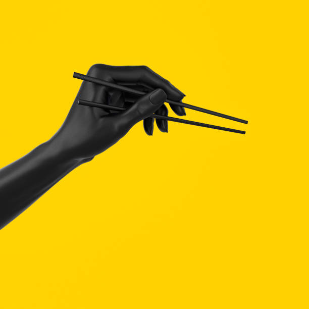 mão preta usando pauzinhos isolados em alimentos amarelos e sushi no menu japonês menu conceito 3d ilustração. - chopsticks human hand women isolated - fotografias e filmes do acervo