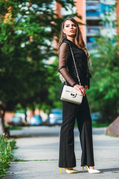 istock Elegant young woman in jumpsuit 1201394939