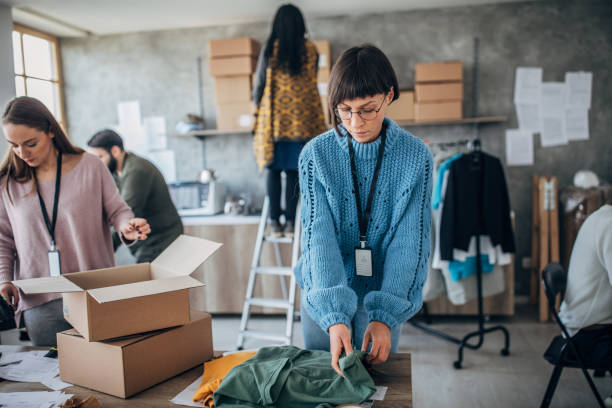 istock Diverse group of people arranging customers orders for drop shipping 1201395236