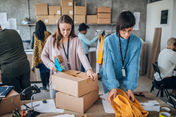 istock Diverse group of people arranging customers orders for drop shipping 1201395951