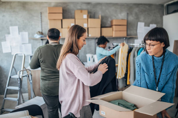 istock Diverse group of people arranging customers orders for drop shipping 1201396013