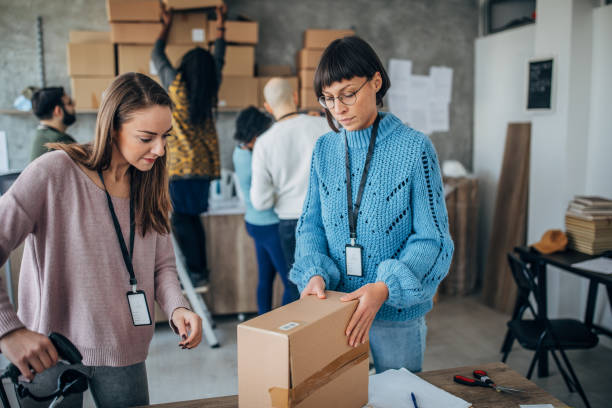 istock Diverse group of people arranging customers orders for drop shipping 1201396027