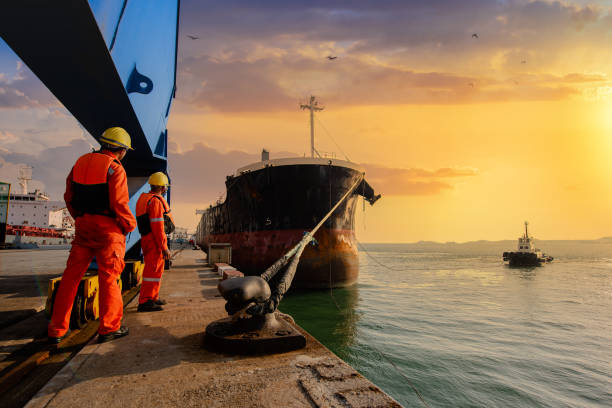 however, 3 mooring man in charge of safety sailing of the ship leaving from the port docks stock pictures, royalty-free photos & images