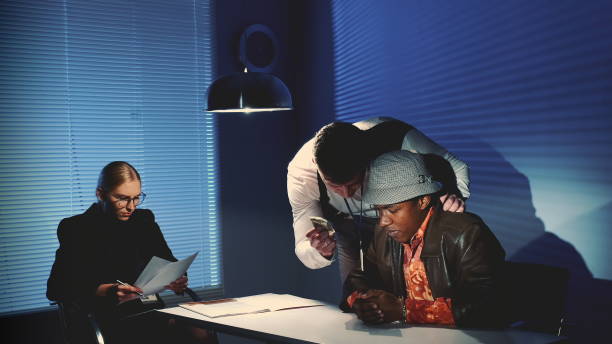 istock Detective uses force in questioning the accused black man 1201396408