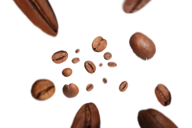 istock roasted coffee beans fly from top to bottom with a motion effect on a white background 1201396973
