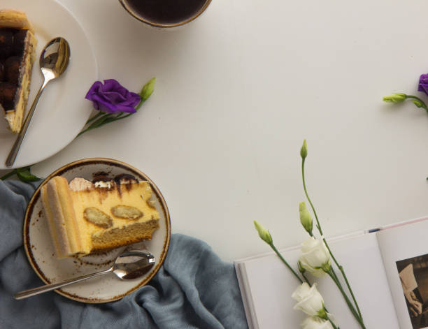 Italian tiramisu slice dessert served on a plate. Fresh Birthday Cake. Isolated on white. Room for text. Clipping Path.  Valentines day, mothers day, womens day, wedding concept. Flat lay, top view, copy space