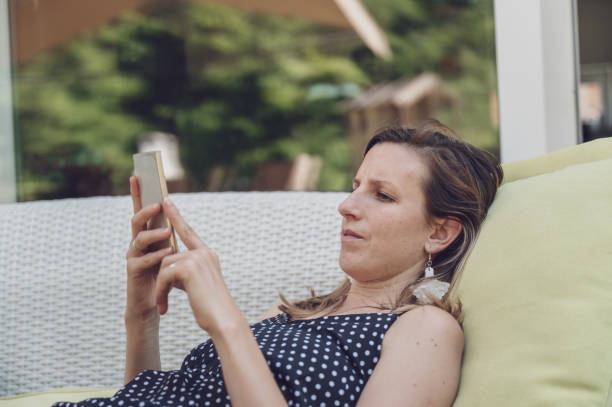 istock Young woman browsing her mobile phone 1201398255