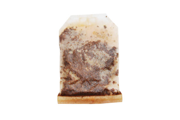 istock Used teabag of black tea isolated on white background 1201398460