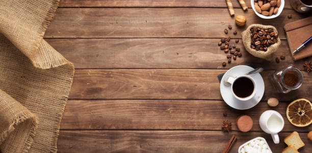istock cup of coffee and beans on wooden background table 1201399212