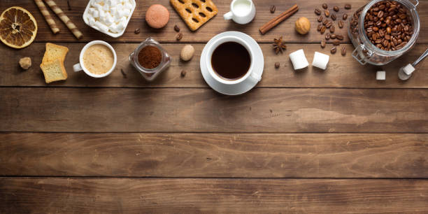 istock cup of coffee and beans on wooden background table 1201399215