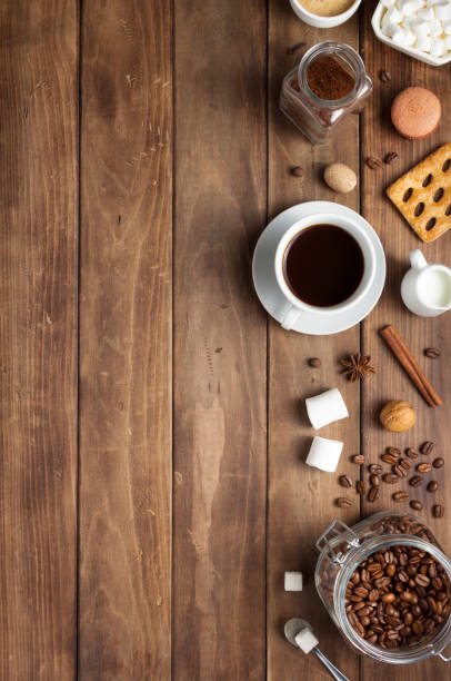 istock cup of coffee and beans on wooden background table 1201399267