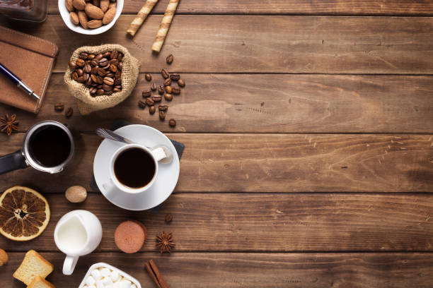 istock cup of coffee and beans on wooden background table 1201399280