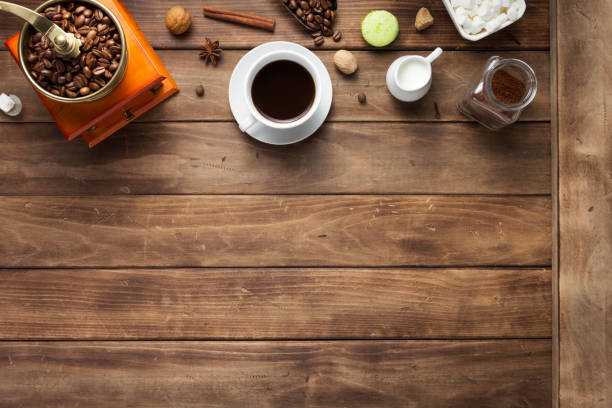 istock cup of coffee and beans on wooden background table 1201399303