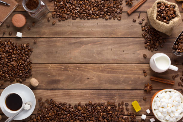 cup of coffee and beans on wooden background table