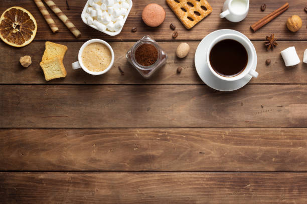 istock cup of coffee and beans on wooden background table 1201399335