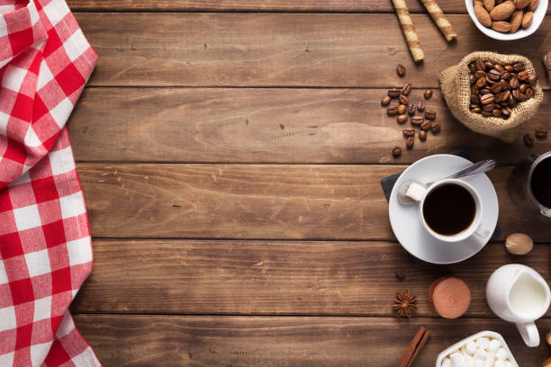 istock cup of coffee and beans on wooden background table 1201399336