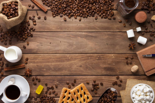 istock cup of coffee and beans on wooden background table 1201399340