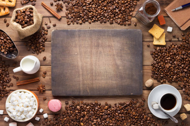 istock cup of coffee and beans on wooden background table 1201399367