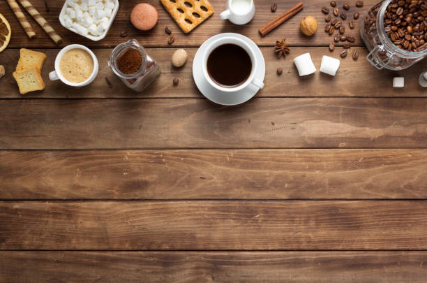 istock cup of coffee and beans on wooden background table 1201399378