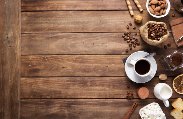 istock cup of coffee and beans on wooden background table 1201399409