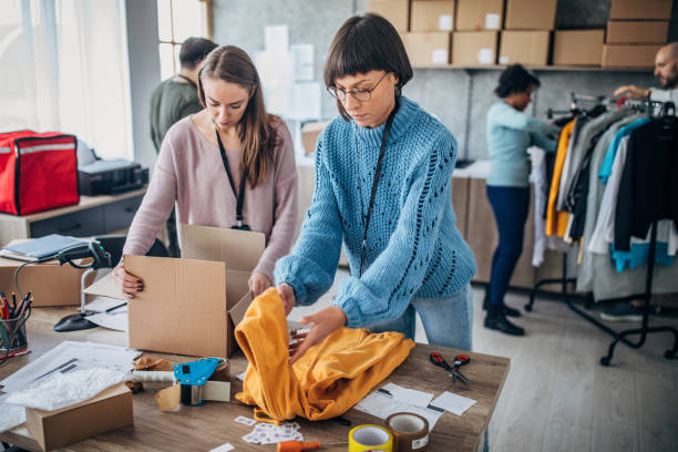 istock Diverse group of people arranging customers orders for drop shipping 1201402243