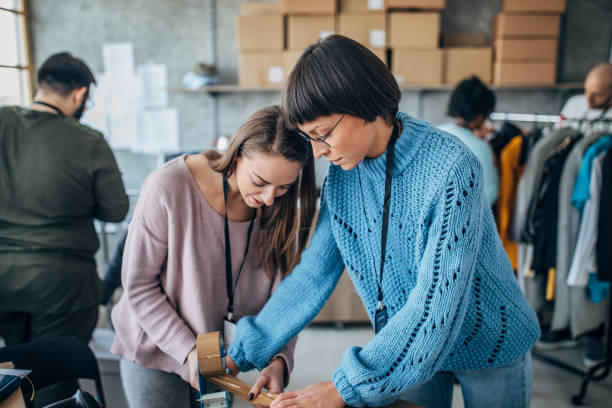 istock Diverse group of people arranging customers orders for drop shipping 1201402286
