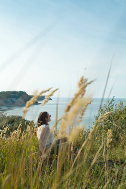 istock Young girl enjoying nature 1201402601