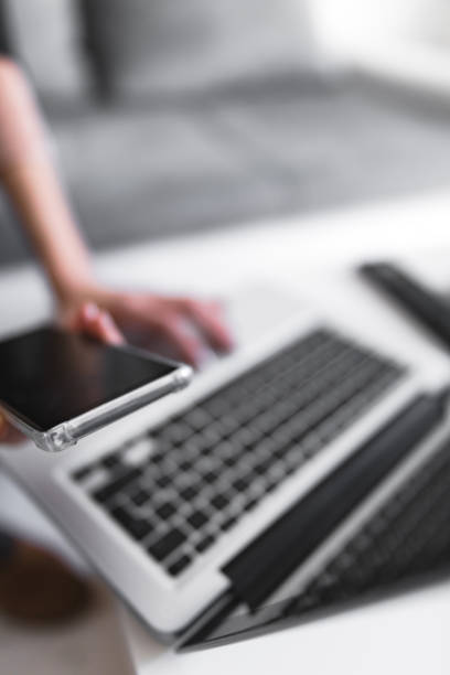 istock Person using laptop and typing on a keyboard. 1201402676