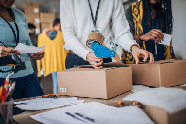 istock Diverse group of people arranging customers orders for drop shipping 1201402984