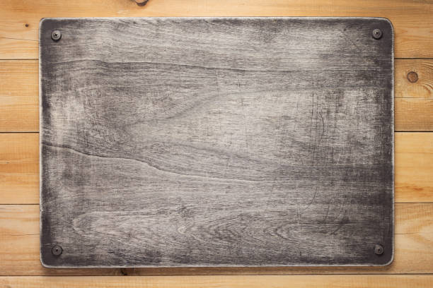 istock nameplate at wooden background texture at plank board wall 1201405265
