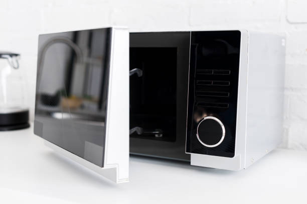 istock close up view of microwave on table in kitchen 1201405299