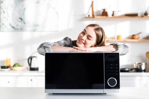 https://media.istockphoto.com/id/1201405315/photo/smiling-and-attractive-woman-lying-on-microwave-in-kitchen.jpg?s=612x612&w=0&k=20&c=Xnm8wL_ycq4O8Dlg7Fji7xtVpnIX-9tWy8u9G4XYIiE=